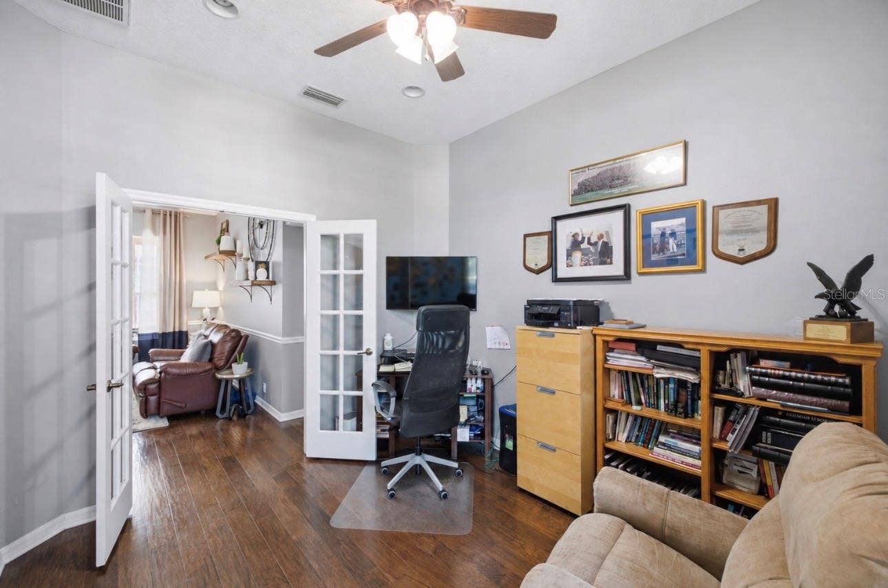 Home Office off of the foyer of the home by the primary suite.