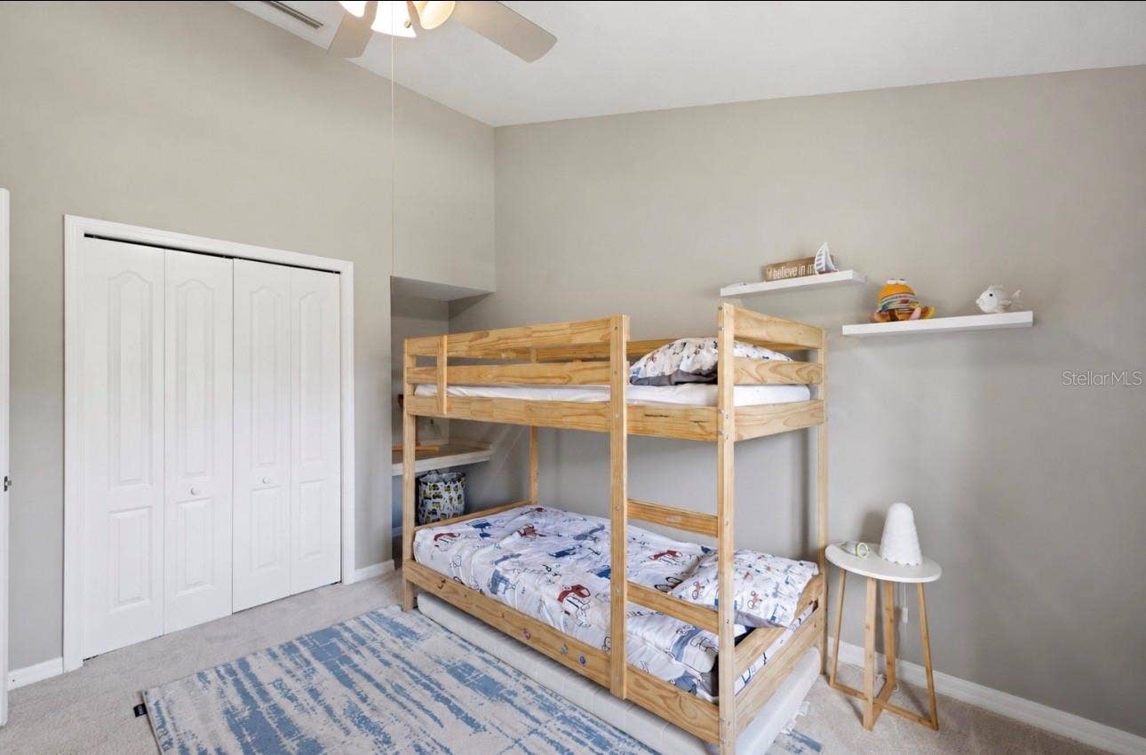 Bedroom #1- custom closet system behind closet doors.