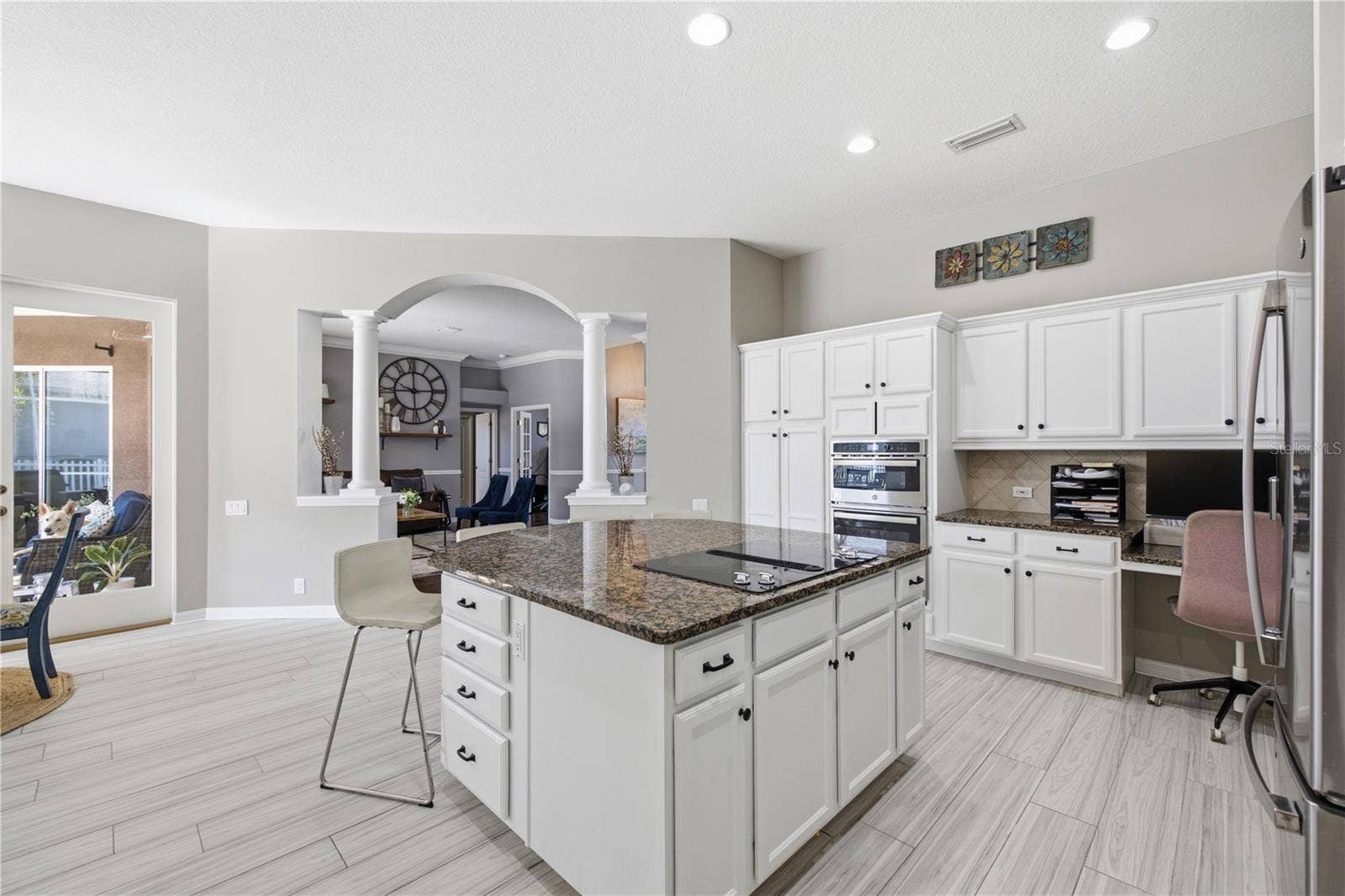 Kitchen Island and Cook top with work station on far side counter area built in.