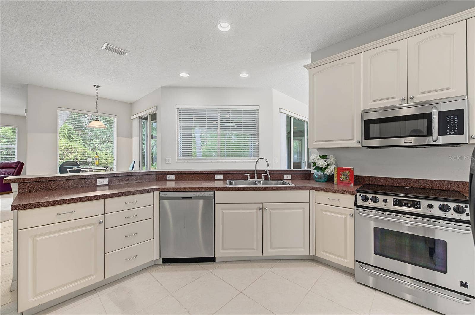 Open Kitchen to the Living Room and Family Room, stainless steel appliances.