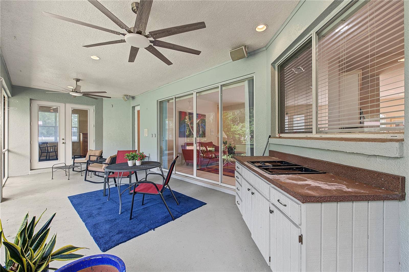 Back Porch with new ceiling fans - French doors off of the master Bedroom