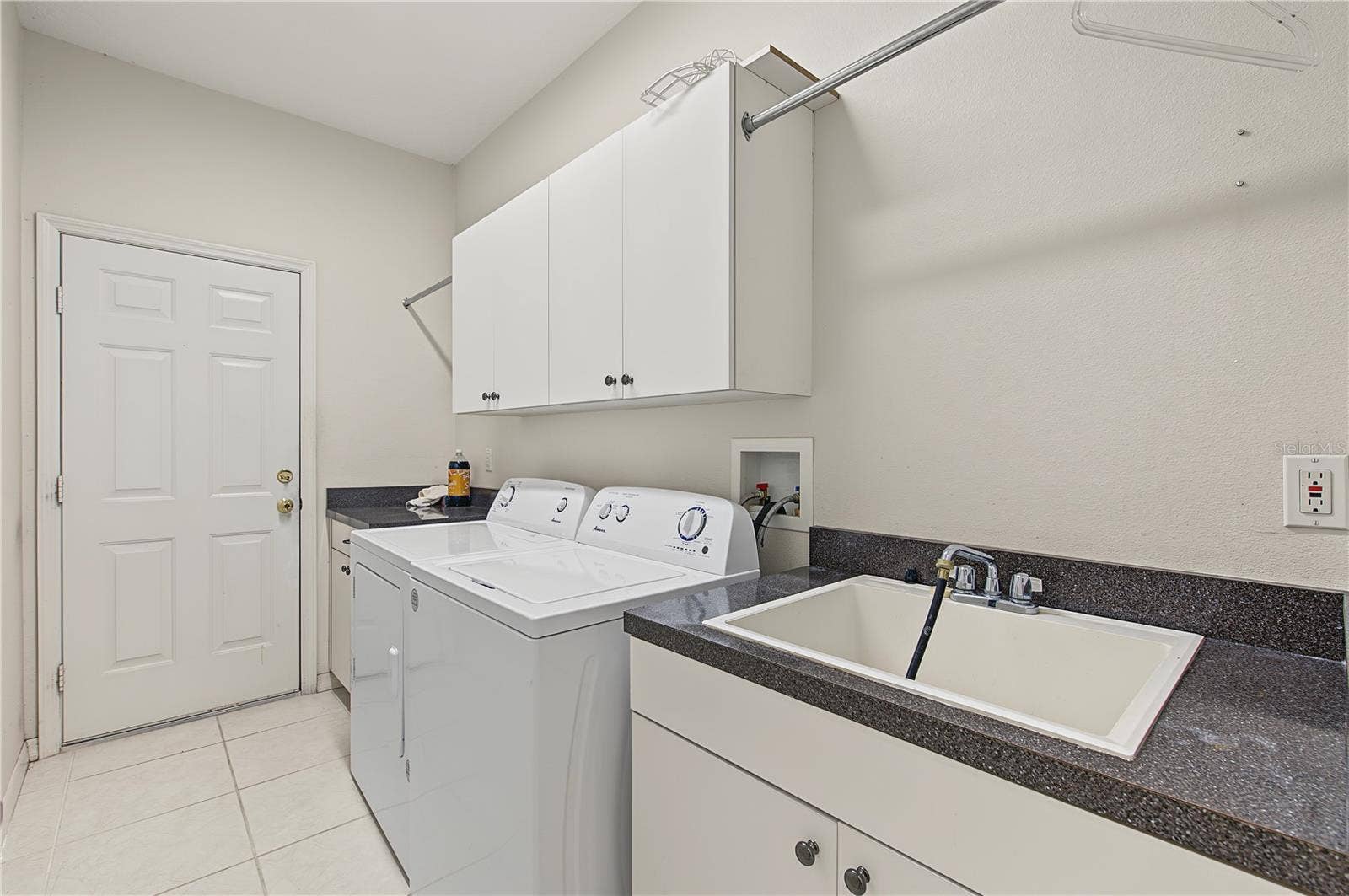 Laundry room and sink coming in from the garage.