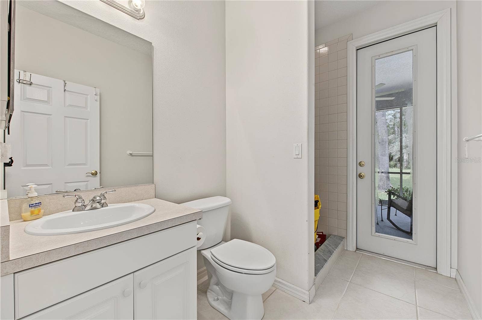 Guest Bathroom with door to the rear patio