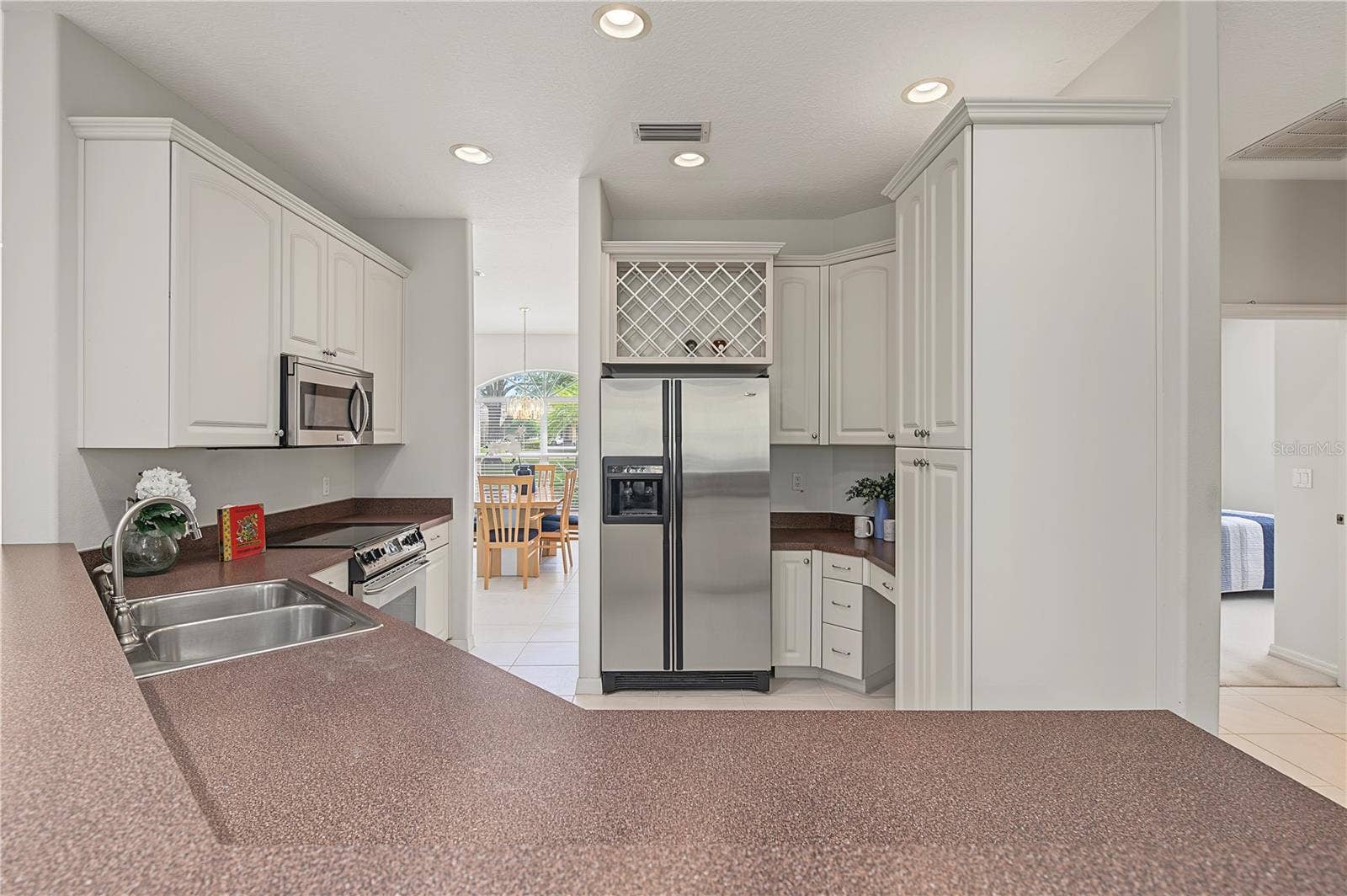 Open Kitchen to the Living Room and Family Room, stainless steel appliances.