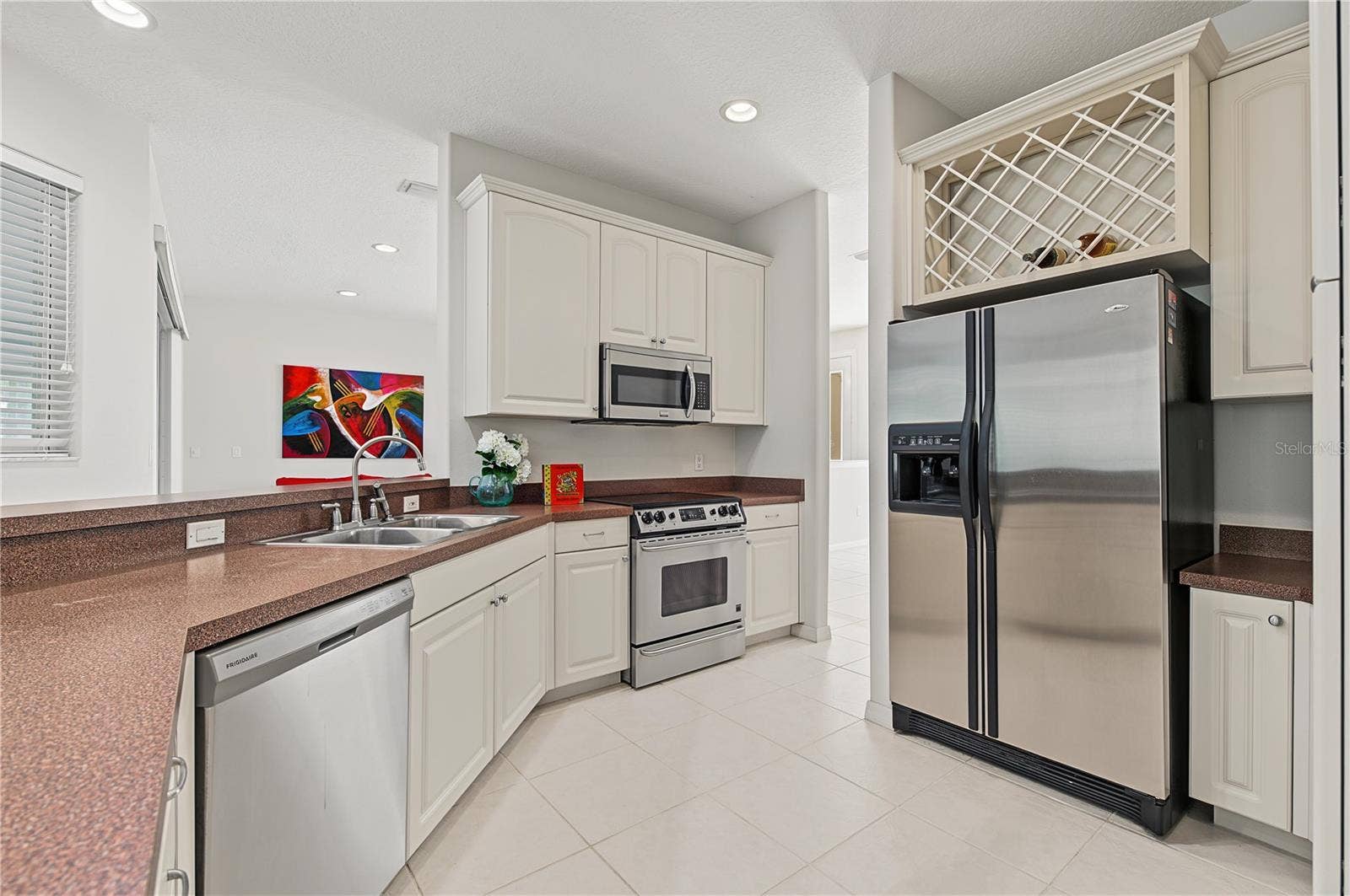 Open Kitchen to the Living Room and Family Room, stainless steel appliances.