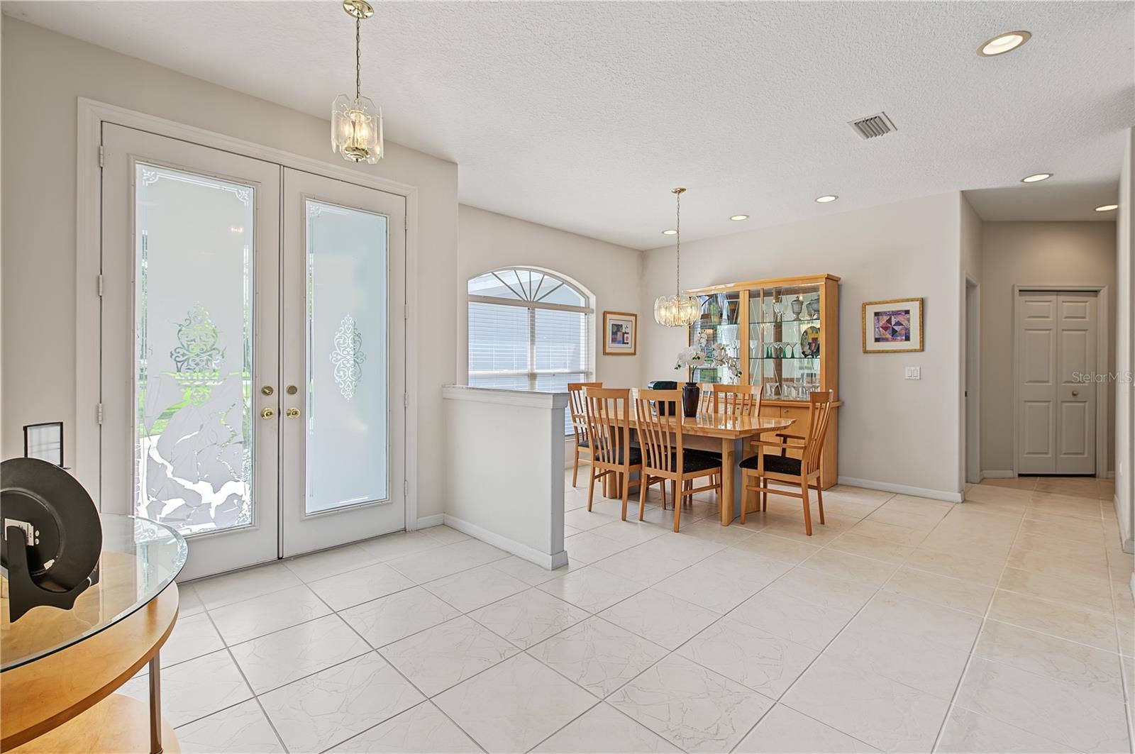 Double Front Doors open to the Dining Room
