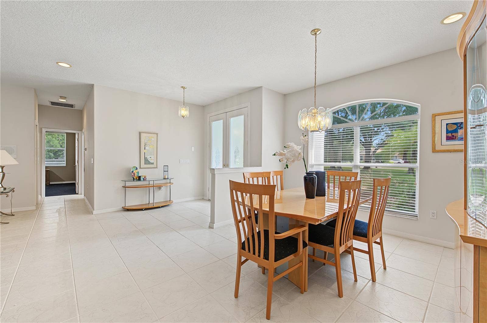 Dining Room area with lots of sunlight and open to the foyer and Living Room.