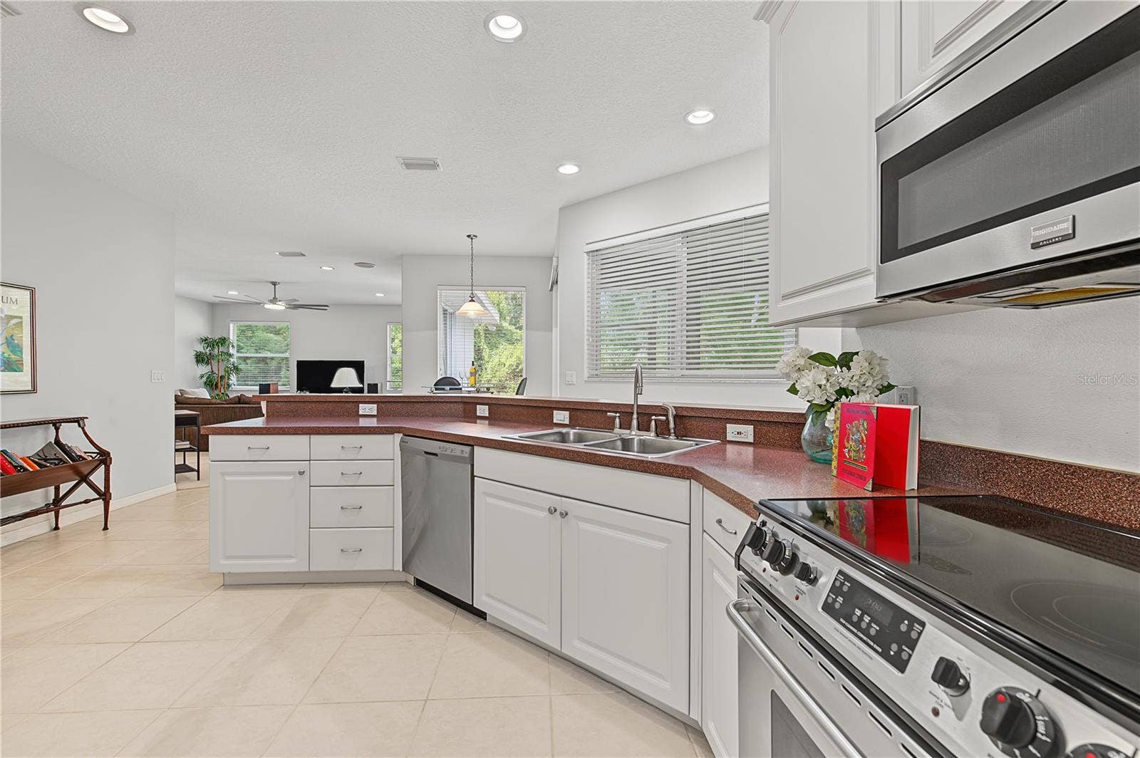 Open Kitchen to the Living Room and Family Room, stainless steel appliances.
