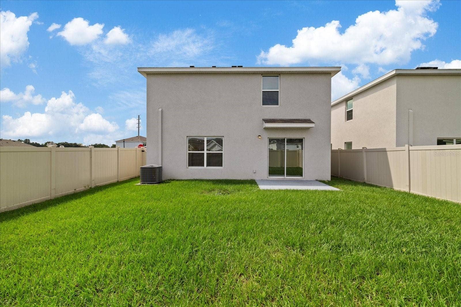 4568 SAND DOLLAR WAY, Zephyrhills, FL 33541 back of the house