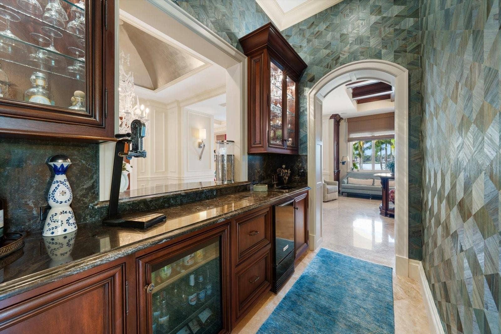 2056 COVE TRACE, Palm Harbor, FL 34685 Beautifully appointed wet bar with ice maker, beverage fridge and beautifully displayed stemware