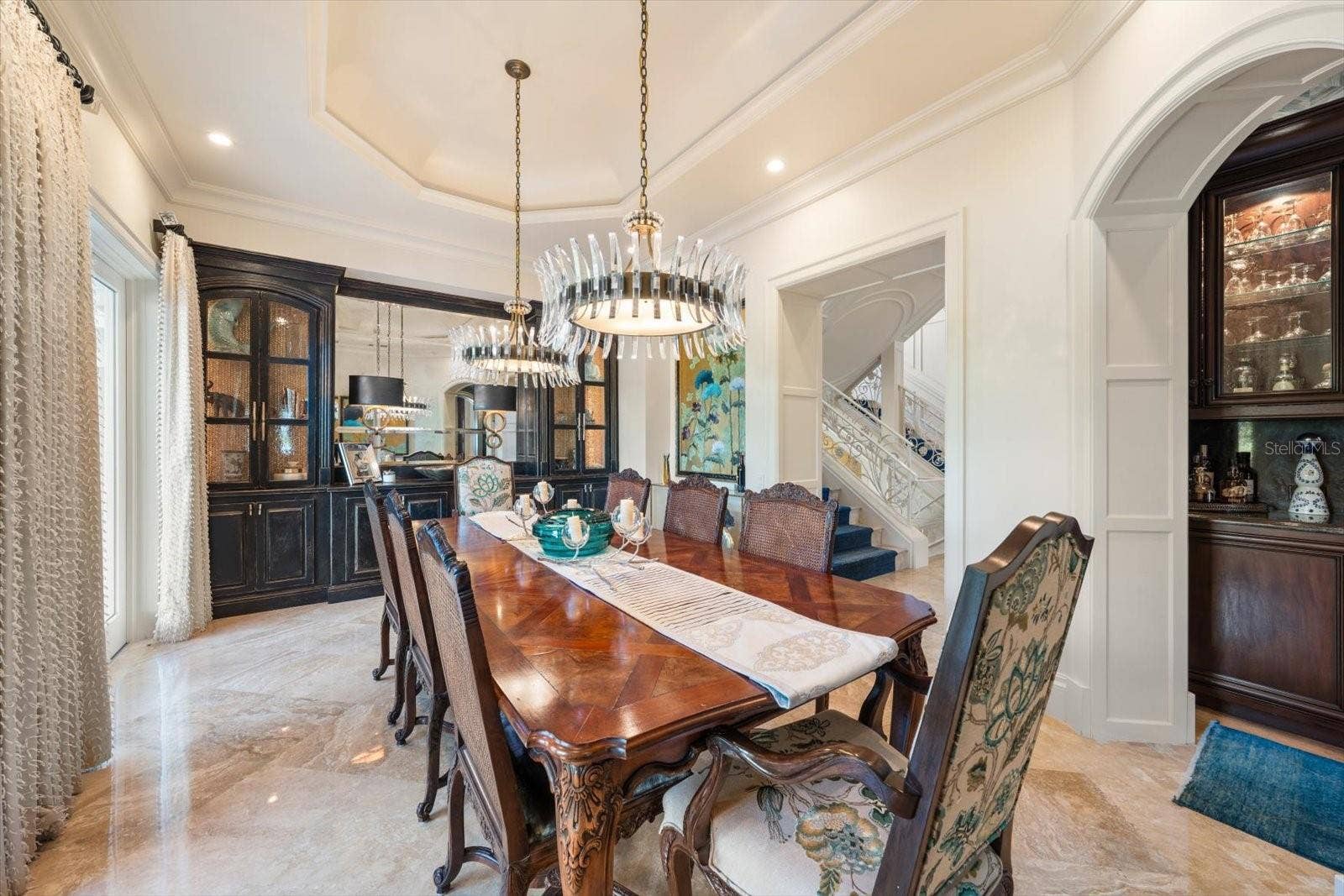 2056 COVE TRACE, Palm Harbor, FL 34685 Illuminated Tray Ceiling, Statement Chandeliers & Arched Doorways