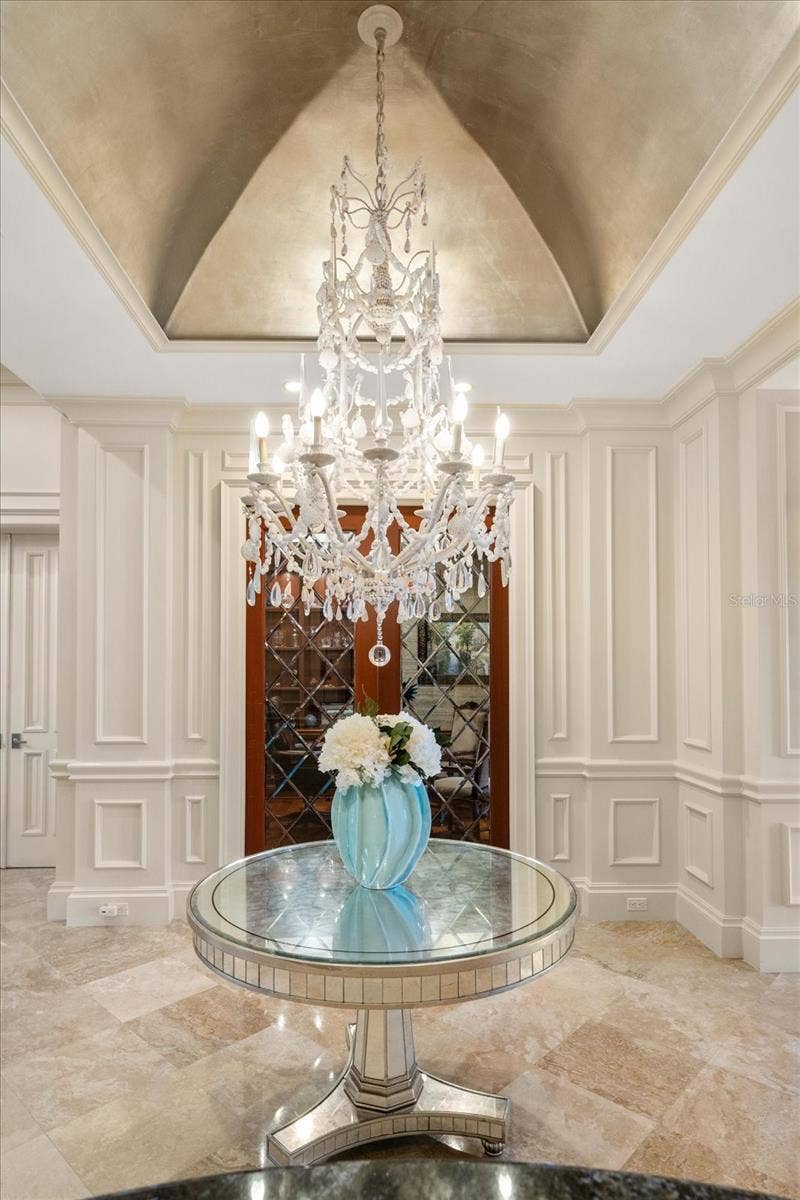 2056 COVE TRACE, Palm Harbor, FL 34685 Elegant, High-End Light Fixtures throughout. Here is a Unique Chandelier with Gold Leaf Dome