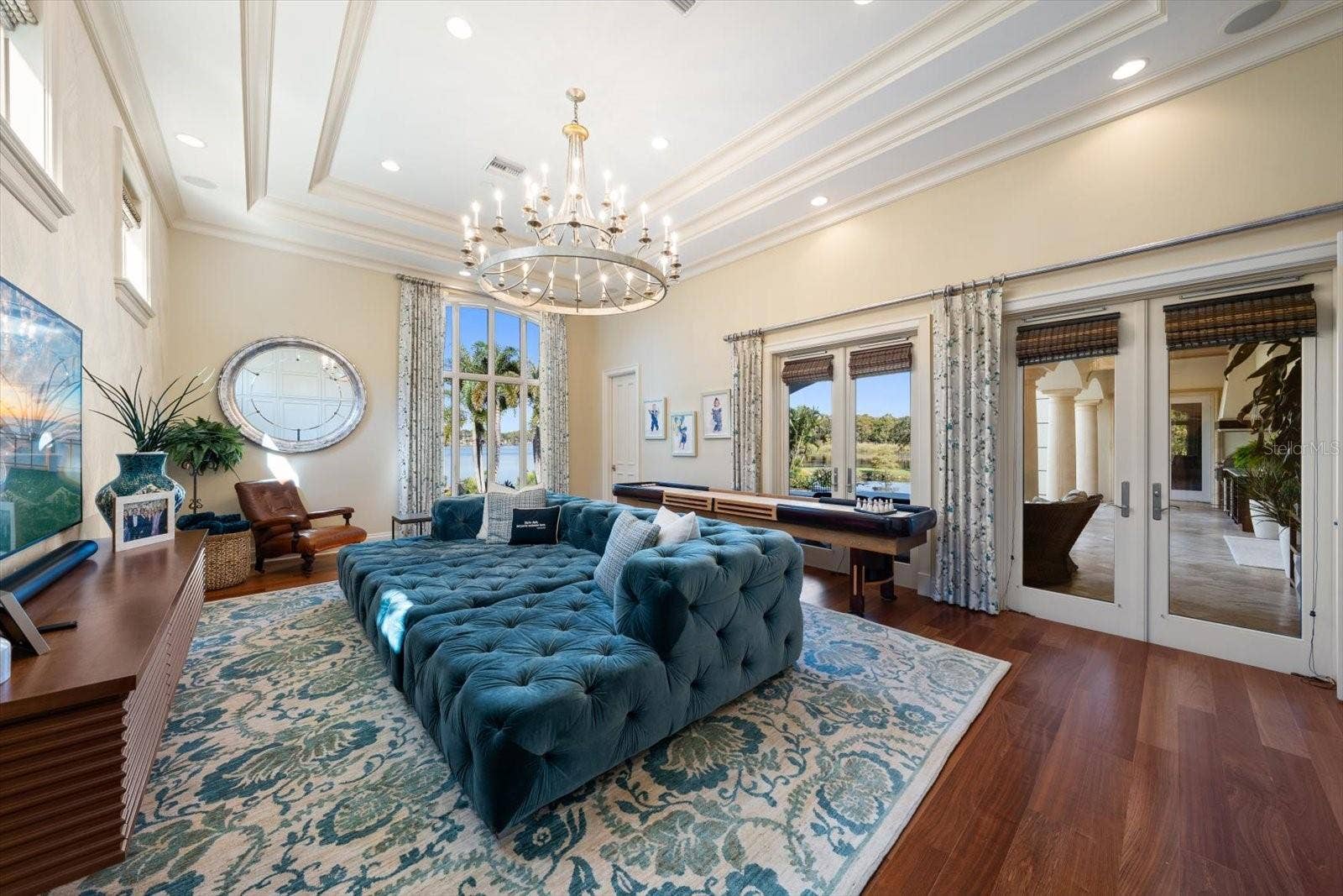 2056 COVE TRACE, Palm Harbor, FL 34685 Jaw-Dropping Family Room with Double French Doors leading outside & Built in Murphy Bed