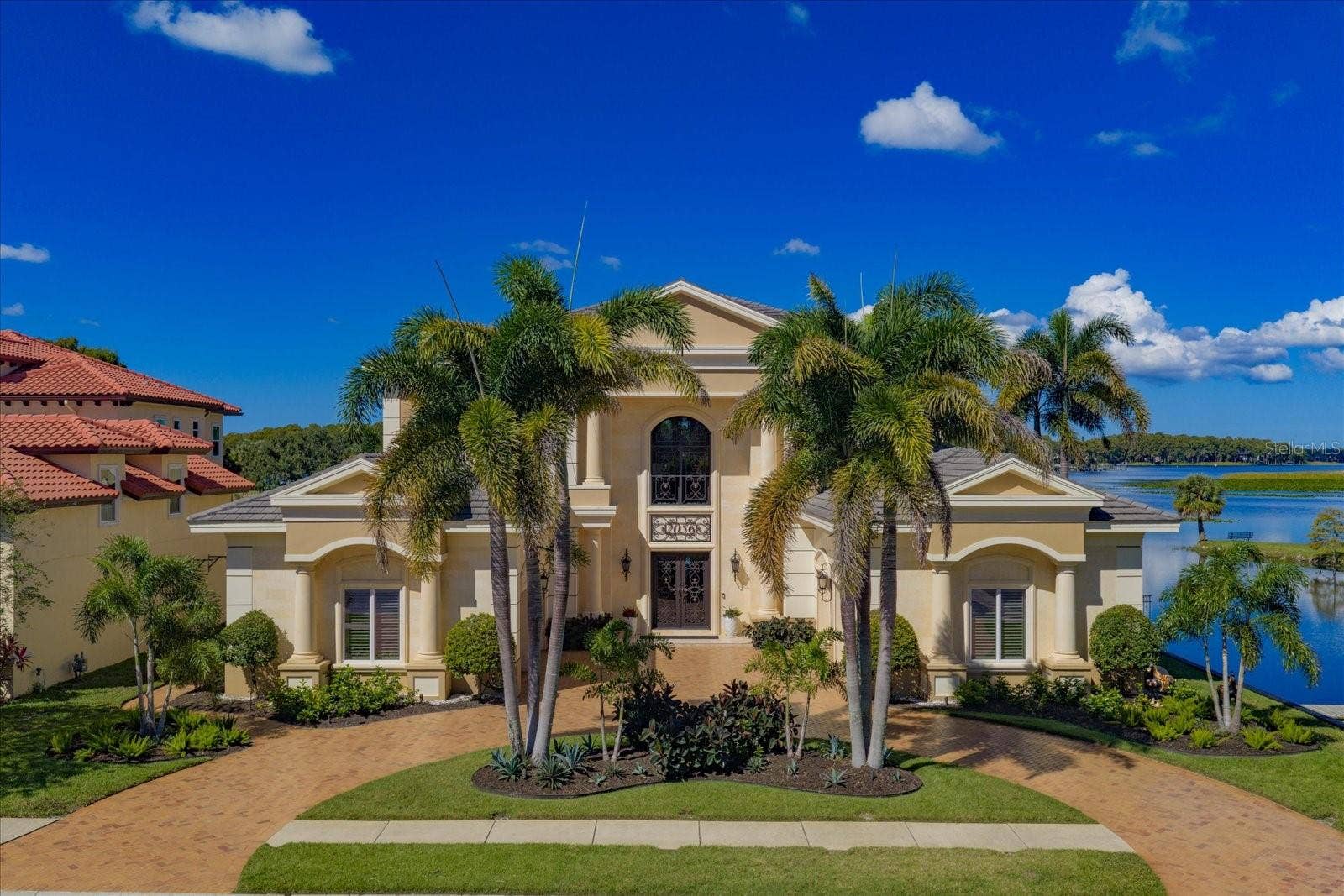 2056 COVE TRACE, Palm Harbor, FL 34685 Once in a Lifetime Opportunity to own this Rare Double-Sided Lake Tarpon Waterfront Estate!