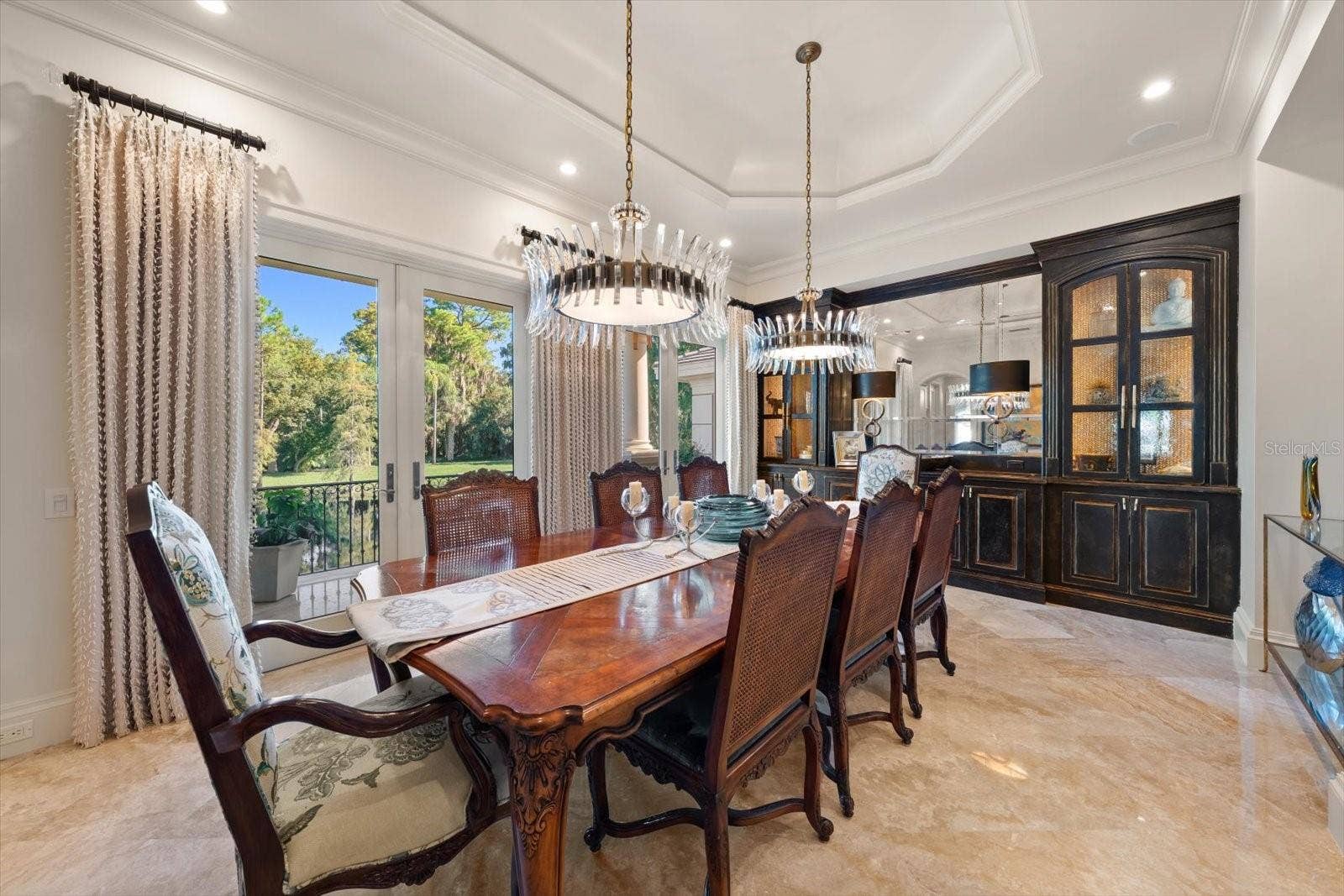2056 COVE TRACE, Palm Harbor, FL 34685 A formal dining room overlooking the lake and natural surroundings