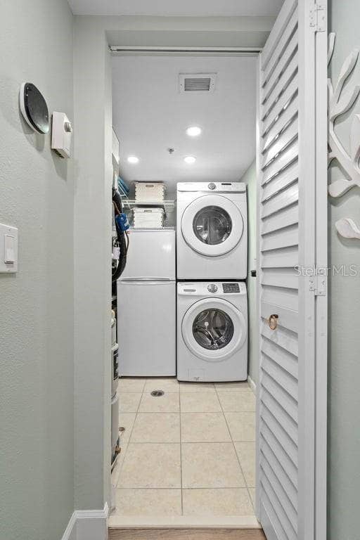1660 GULF BOULEVARD, #706, Clearwater, FL 33767 Laundry room with extra refrigerator.