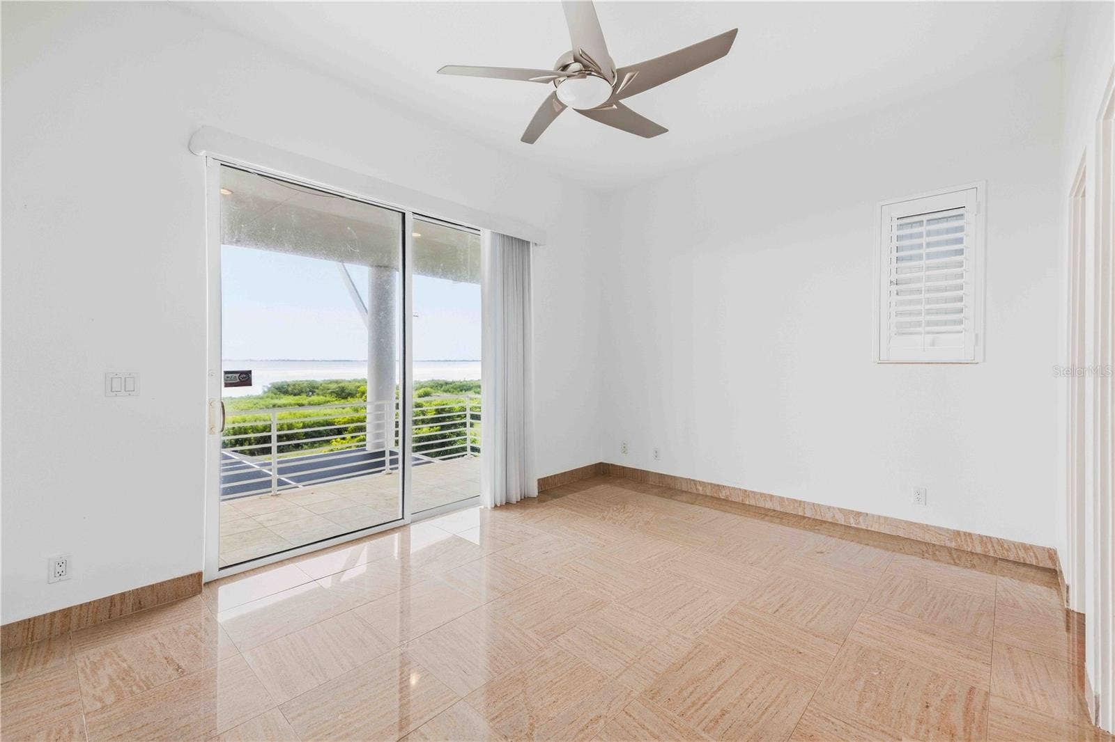 4908 64TH DRIVE W, Bradenton, FL 34210 Bedroom 2 with balcony and a view (w/ en suite)