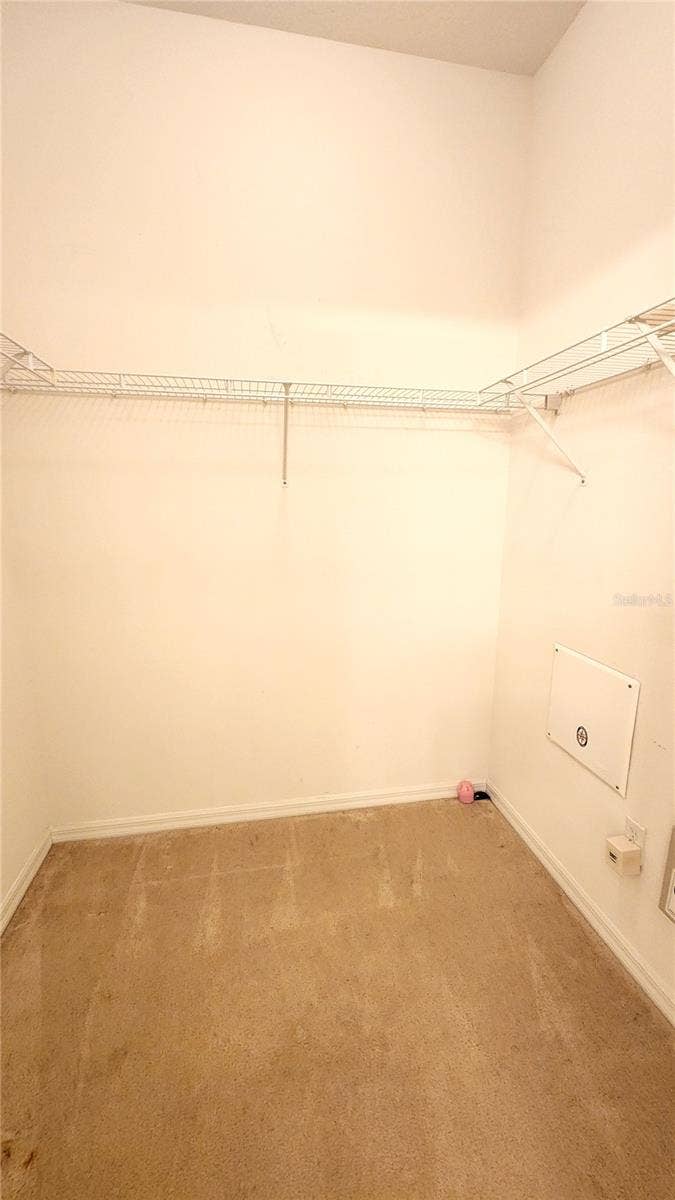 642 SPRING LAKE CIRCLE, Tarpon Springs, FL 34688 Large walk-in closet in primary bedroom.