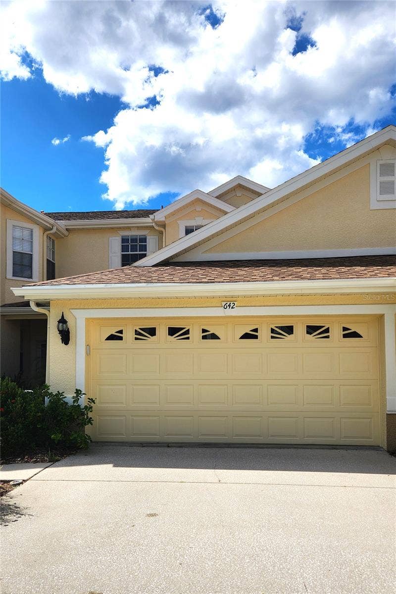 642 SPRING LAKE CIRCLE, Tarpon Springs, FL 34688 Double Garage with parking space.