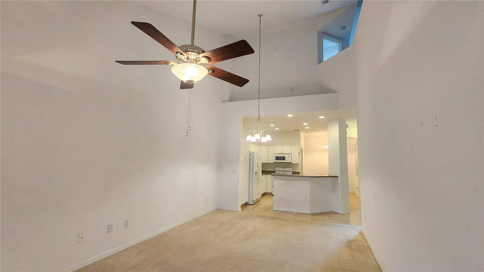 642 SPRING LAKE CIRCLE, Tarpon Springs, FL 34688 View from Living Room into Kitchen.