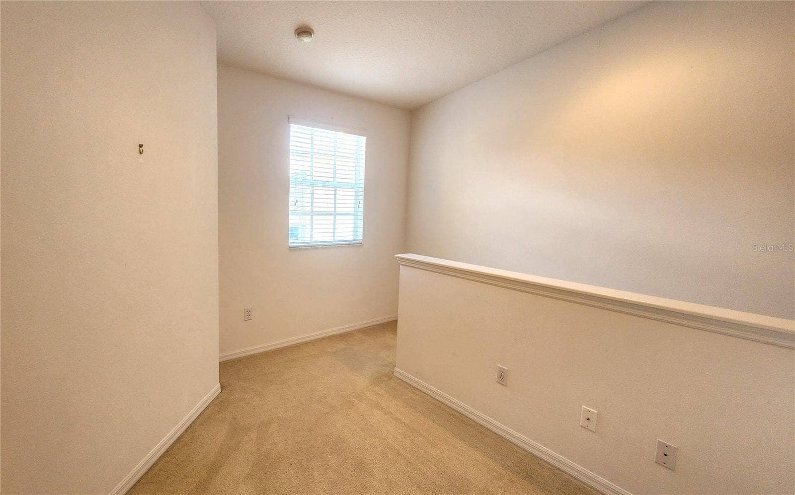 642 SPRING LAKE CIRCLE, Tarpon Springs, FL 34688 Loft Area leading to 2nd and 3rd Bedroom.