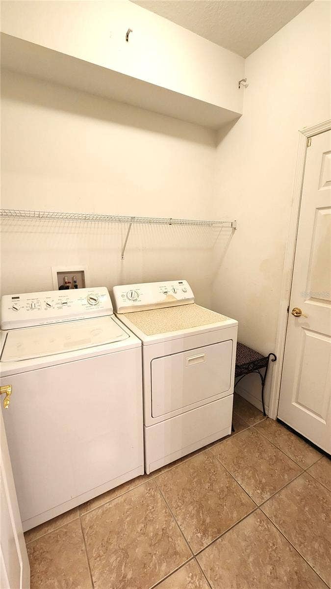 642 SPRING LAKE CIRCLE, Tarpon Springs, FL 34688 Inside Laundry Room off Kitchen and from Garage.