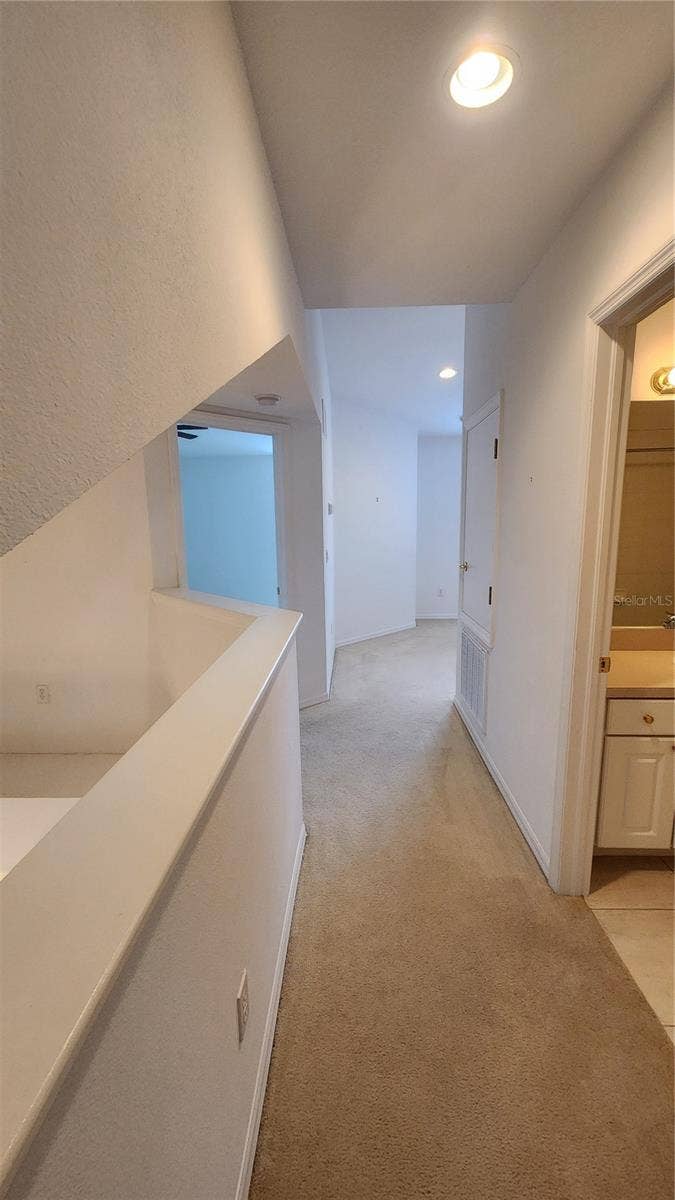 642 SPRING LAKE CIRCLE, Tarpon Springs, FL 34688 View from 3rd Bedroom into loft and guest bathroom.