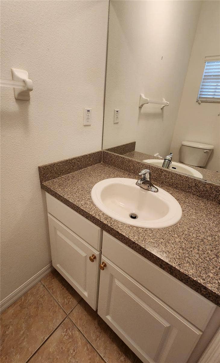 642 SPRING LAKE CIRCLE, Tarpon Springs, FL 34688 Guest Half bath downstairs.