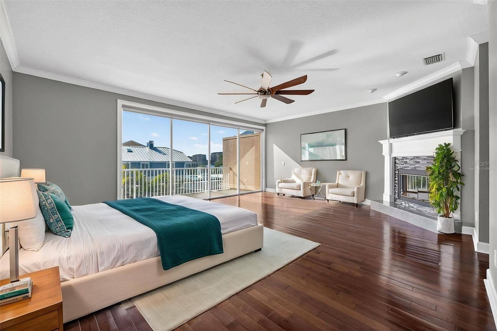 348 LARBOARD WAY, Clearwater, FL 33767 VIrtually staged Primary Bedroom with private balcony