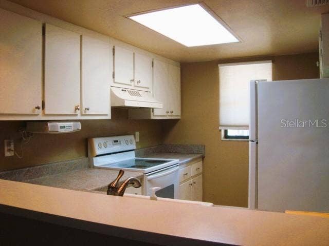 11485 OAKHURST ROAD, #A106, Largo, FL 33774 KITCHEN AREA/INSIDE STACKABE WASHER/DRYER