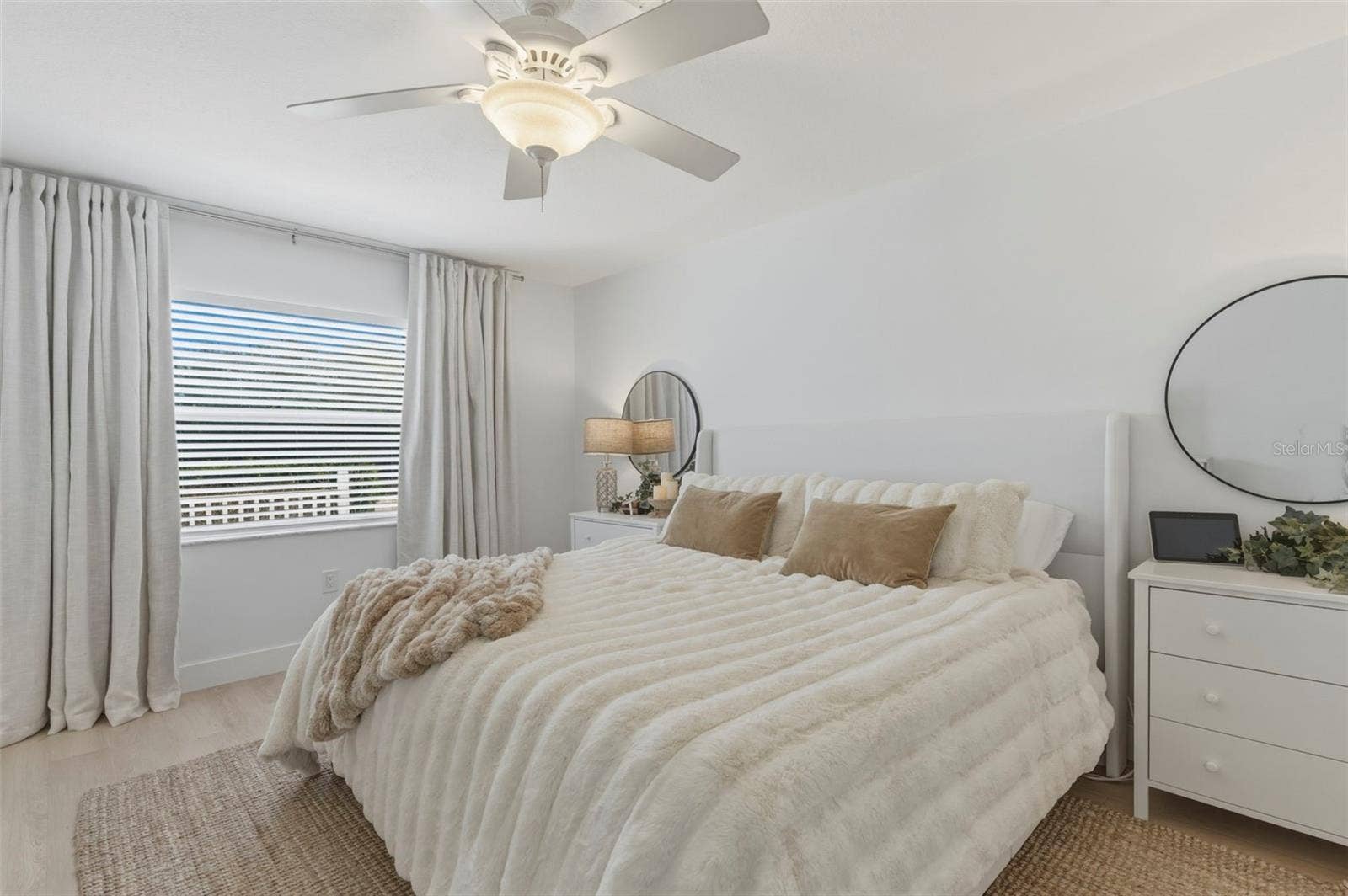 Primary bedroom, light and bright with darken curtains. Plenty big for a King size bed set.