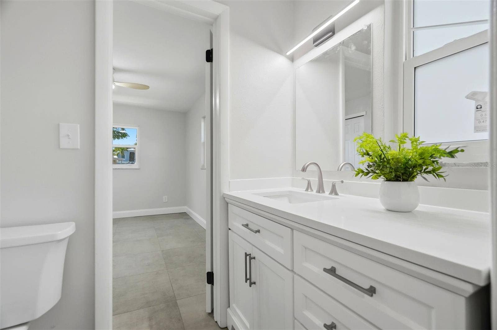 4700 14TH STREET NE, St Petersburg, FL 33703 A convenient Jack-and-Jill bath connects two secondary bedrooms.