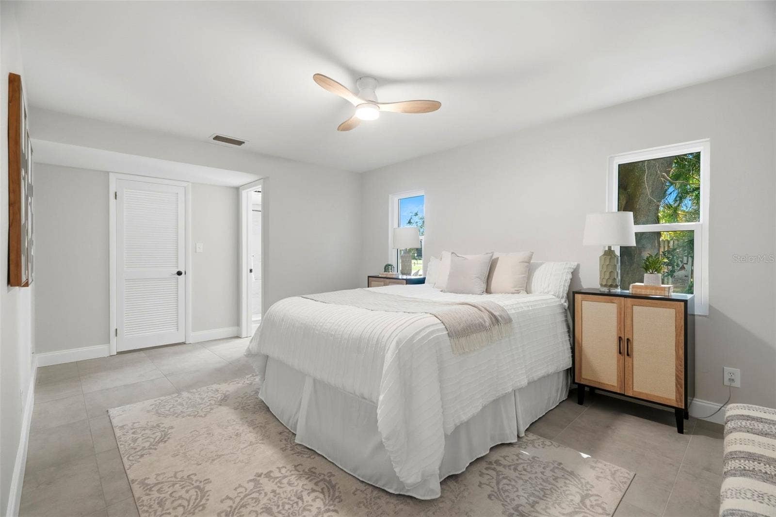 4700 14TH STREET NE, St Petersburg, FL 33703 The spacious primary suite includes a walk-in closet and ensuite bath.