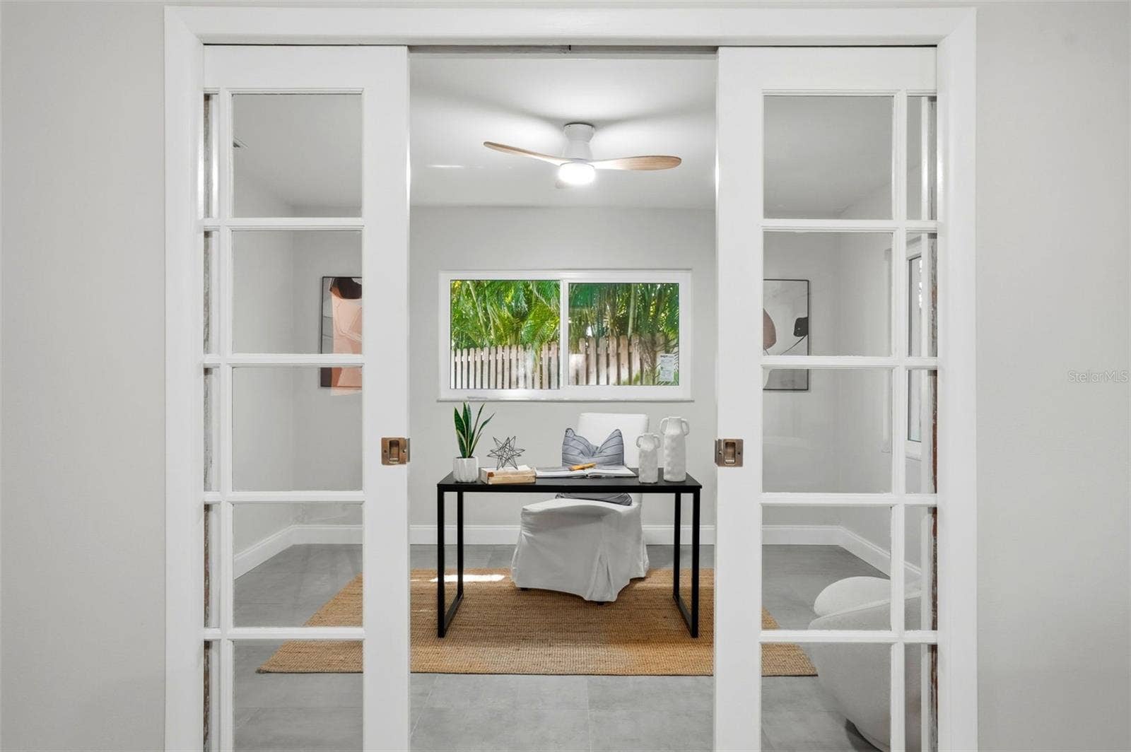 4700 14TH STREET NE, St Petersburg, FL 33703 French pocket doors open to an additional room creating an ideal spot for a home office, studio, yoga room, or quiet retreat.