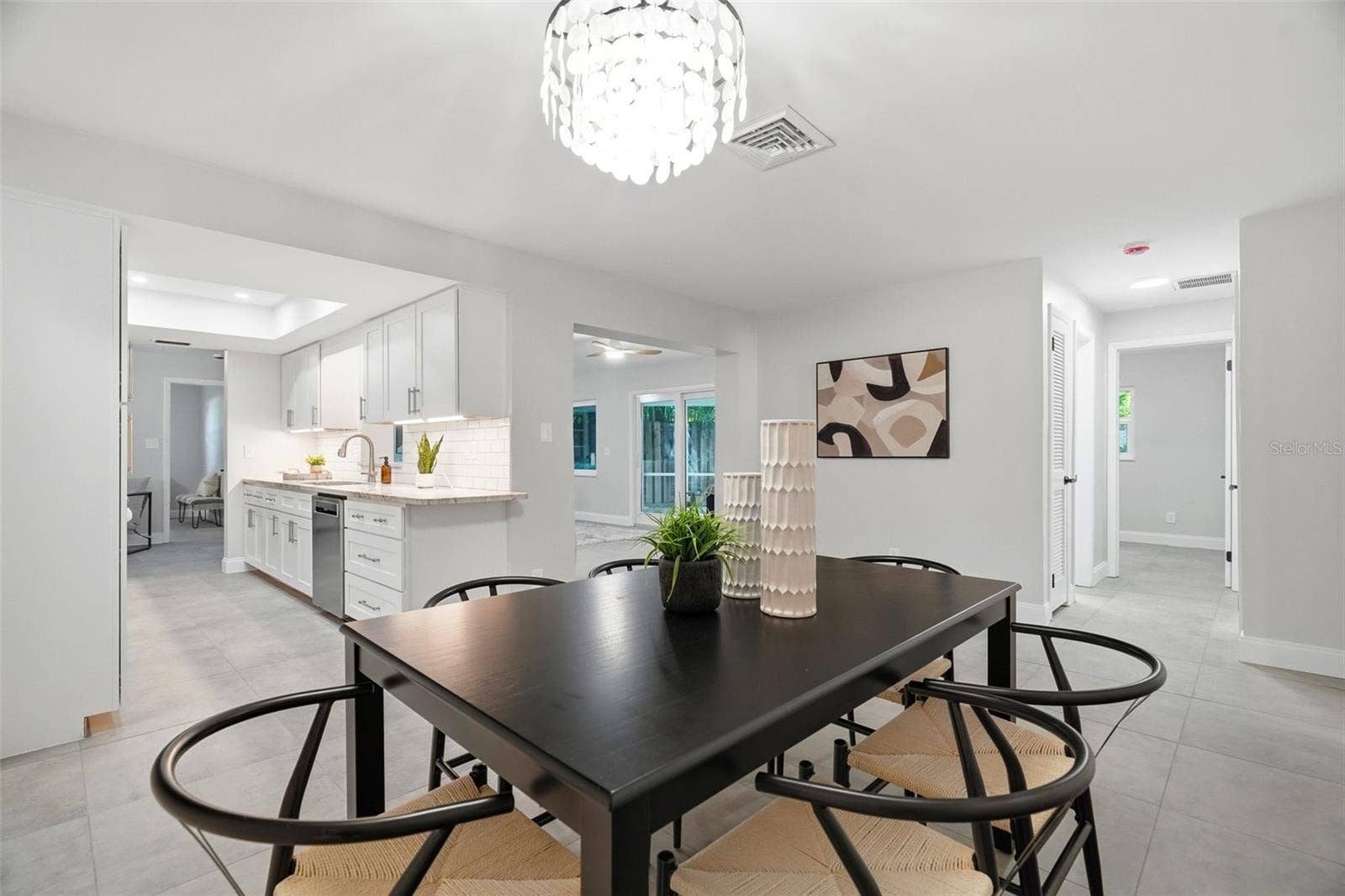 4700 14TH STREET NE, St Petersburg, FL 33703 Casual and formal dining options, along with a separate living room and family room, provide flexibility for gathering and entertaining.
