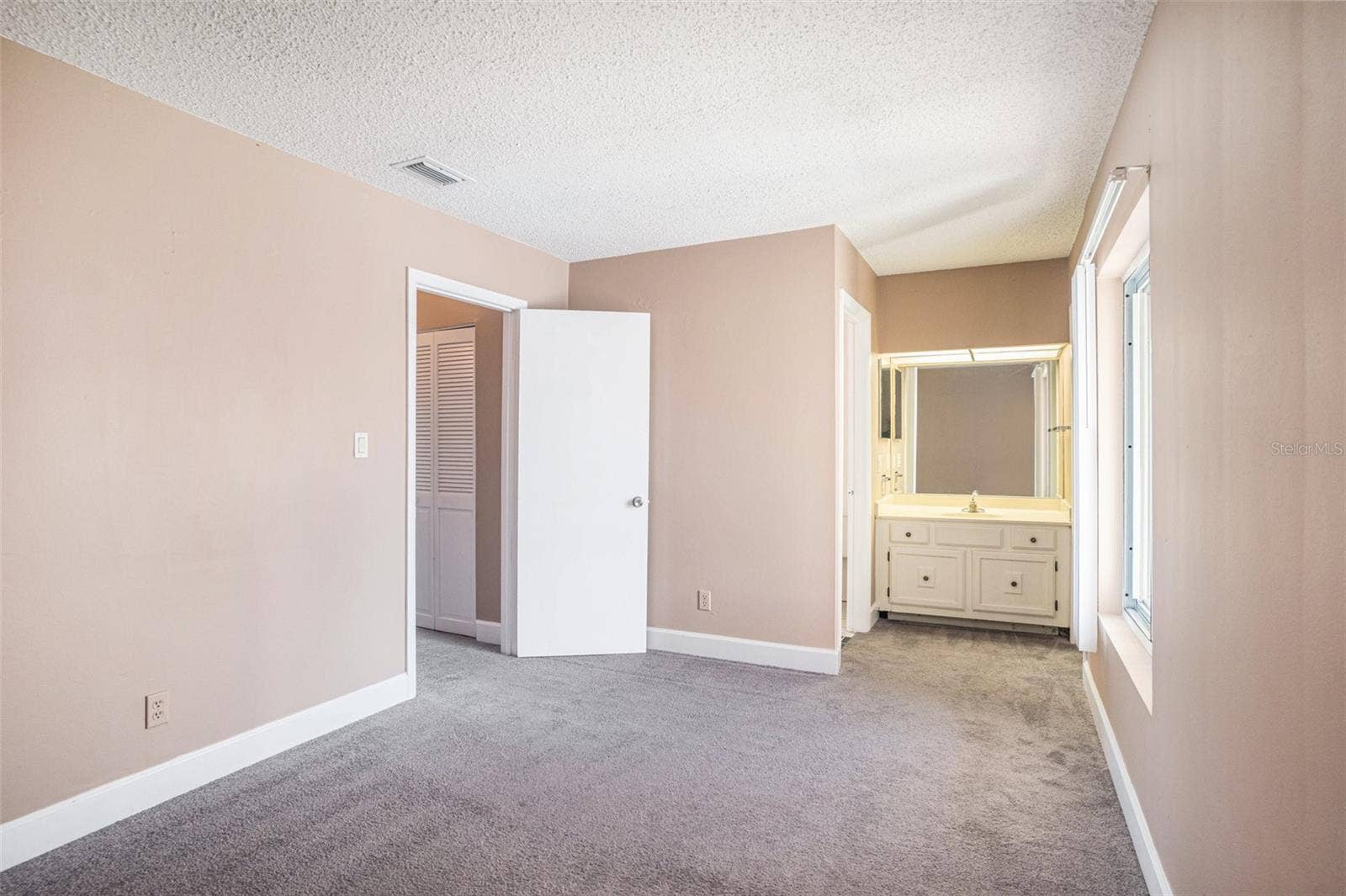 8719 COVE COURT, #10, Tampa, FL 33615 Each room has a private vanity. Carpet has been replaced with LVP