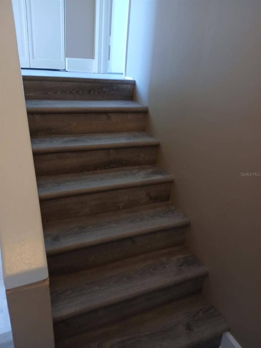 8719 COVE COURT, #10, Tampa, FL 33615 Stairs and upper-level carpet have been replaced with LVP