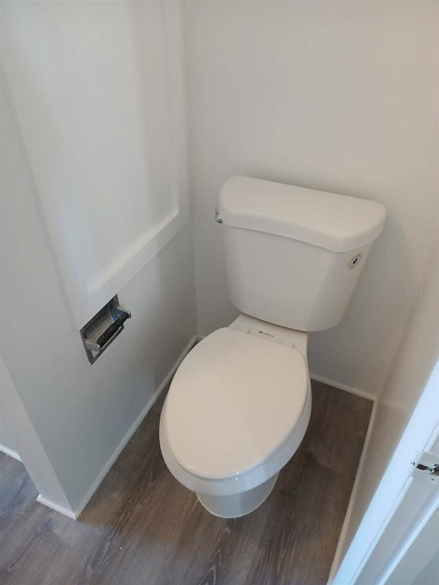 8719 COVE COURT, #10, Tampa, FL 33615 New toilet and upper-level flooring.