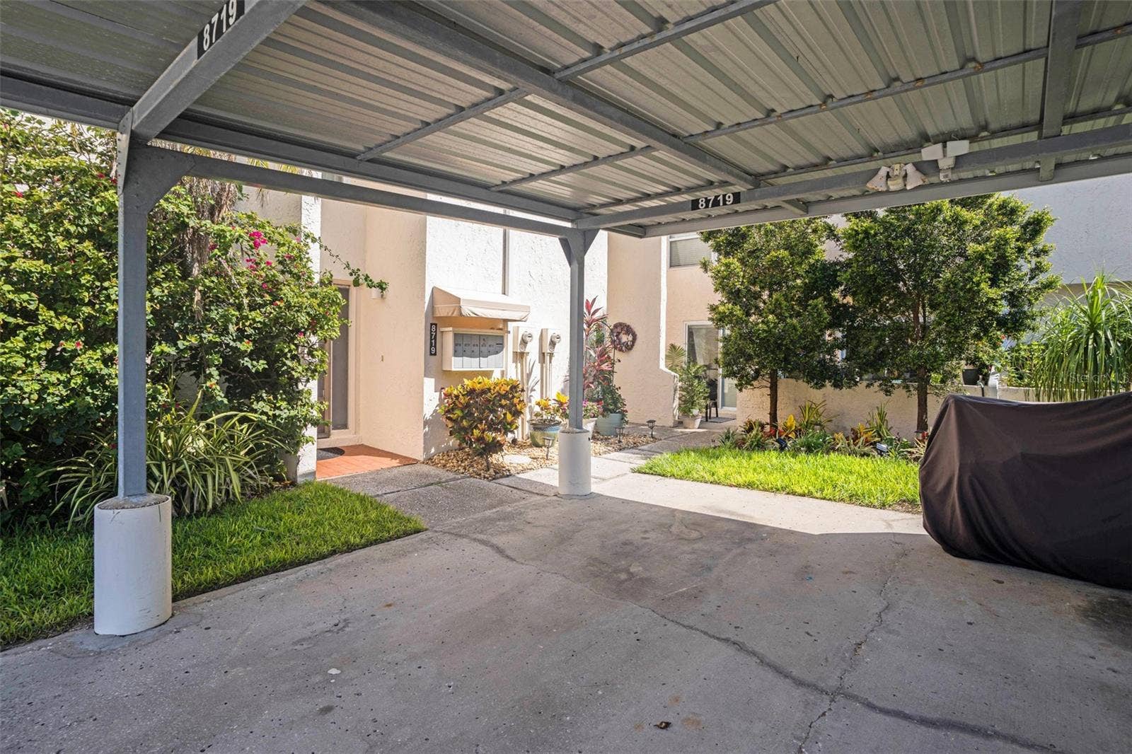 8719 COVE COURT, #10, Tampa, FL 33615 Assigned carport is at your front door!