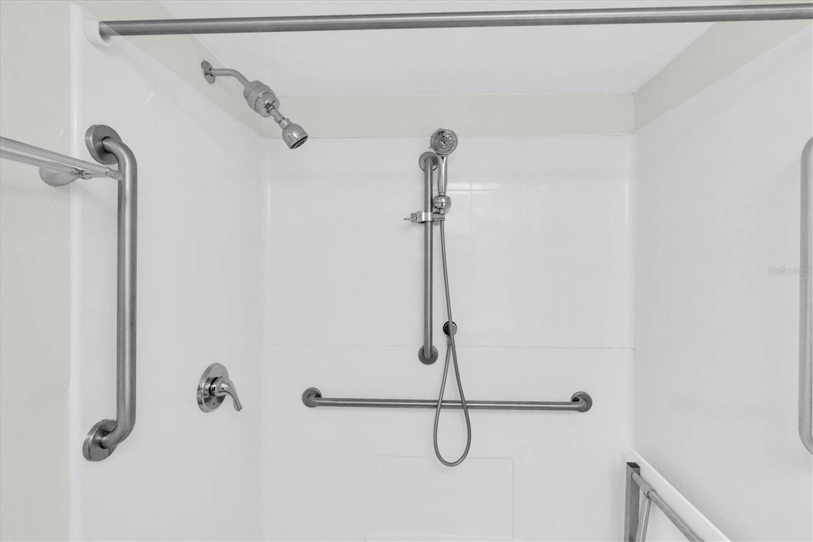 Ensuite Step-In Shower with Grab Bars and Seat.