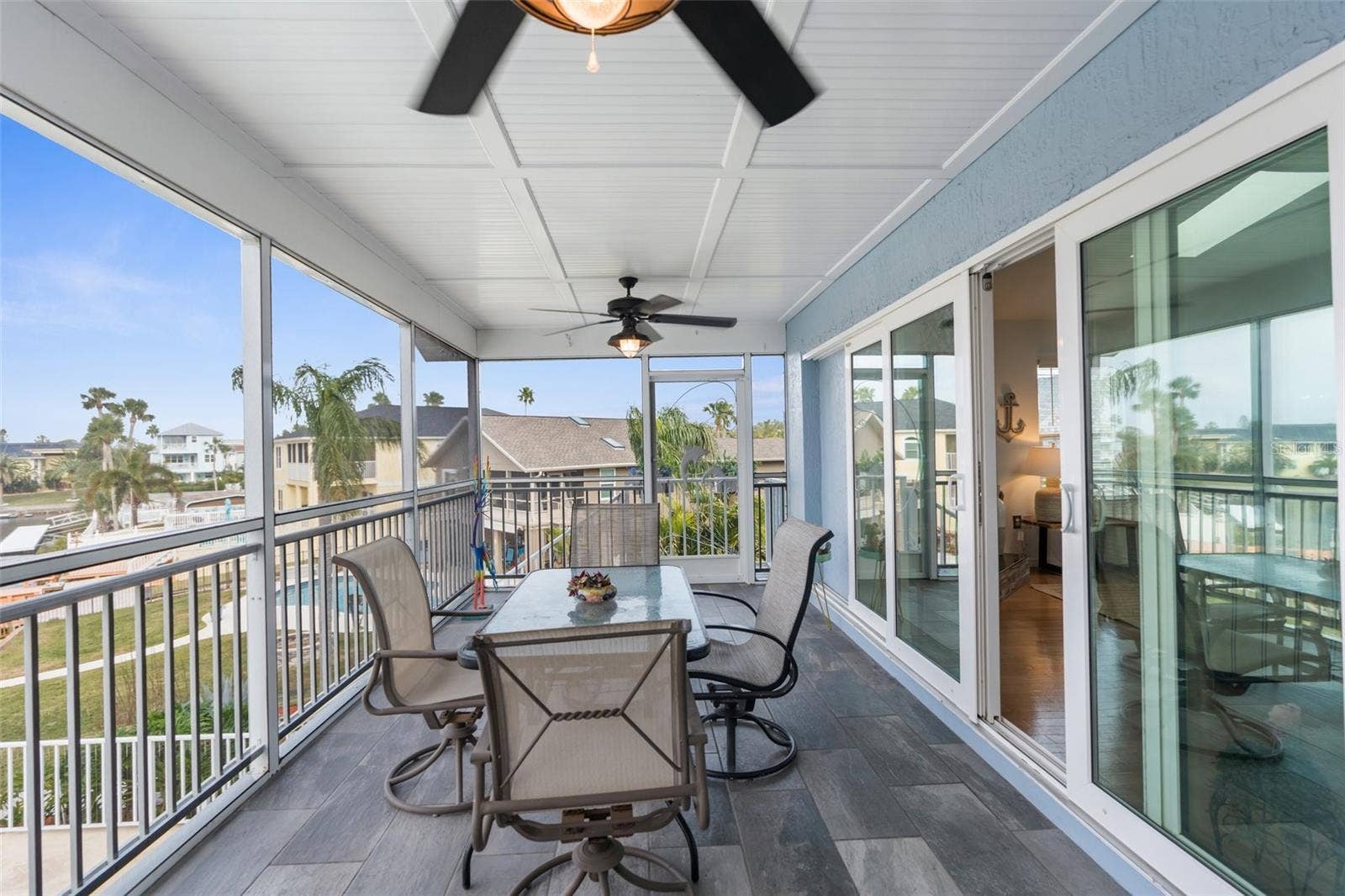 6029 BAYWAY COURT, New Port Richey, FL 34652 Back exposure deck off living room (screened). Located on second story.