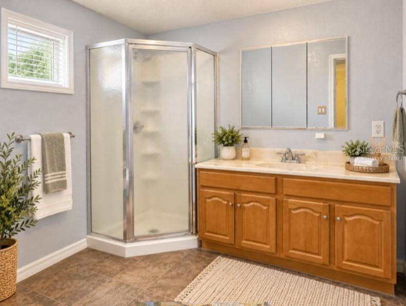 16421 HANNA ROAD, Lutz, FL 33549 Virtually staged en suite bathroom. There is no towel bar to the left side.