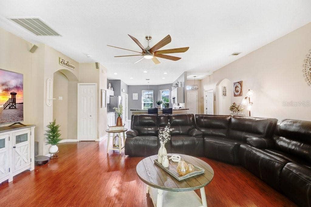 Living room with view into kitchen