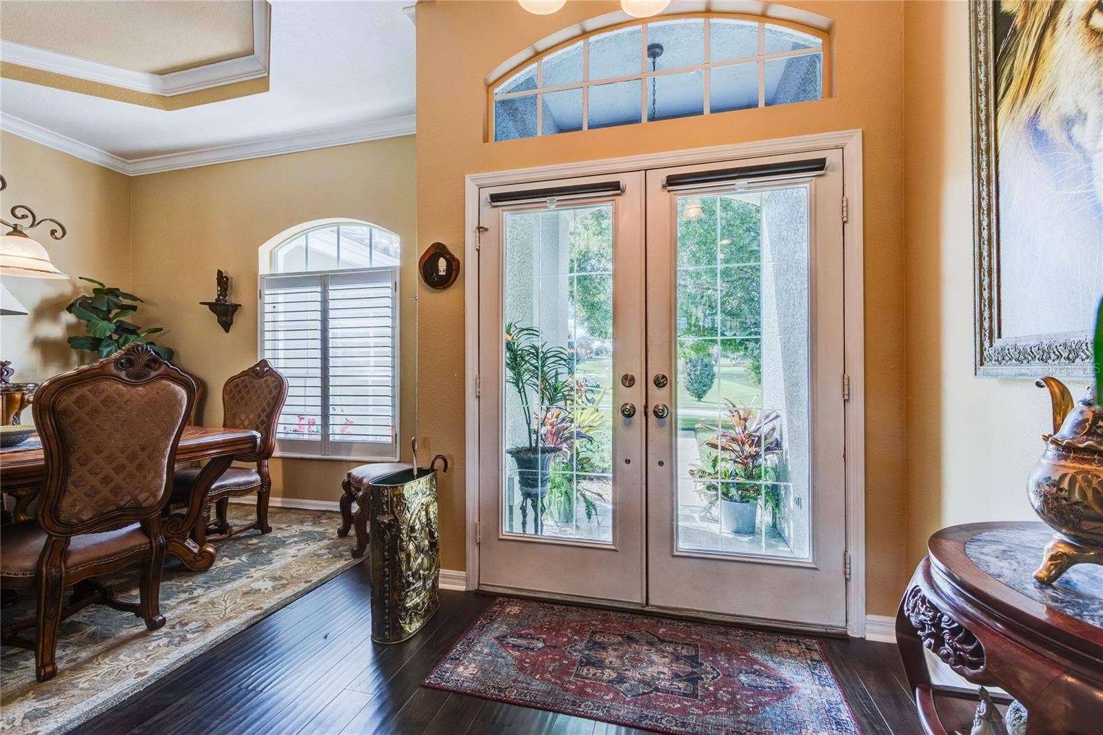 Double glass doors open to a serene golf course view at front too!