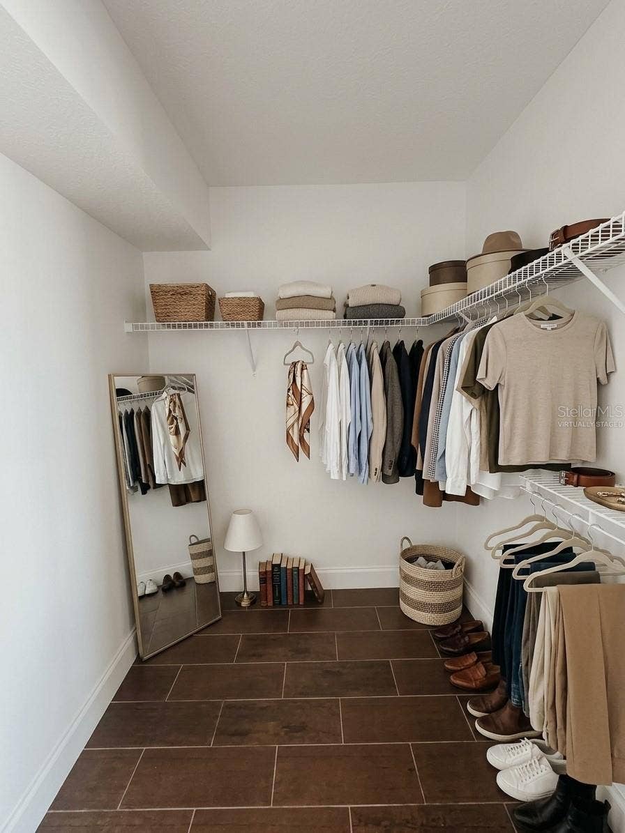 2617 COVE CAY DRIVE, #107, Clearwater, FL 33760 Virtually Staged Primary Bedroom Walk In Closet