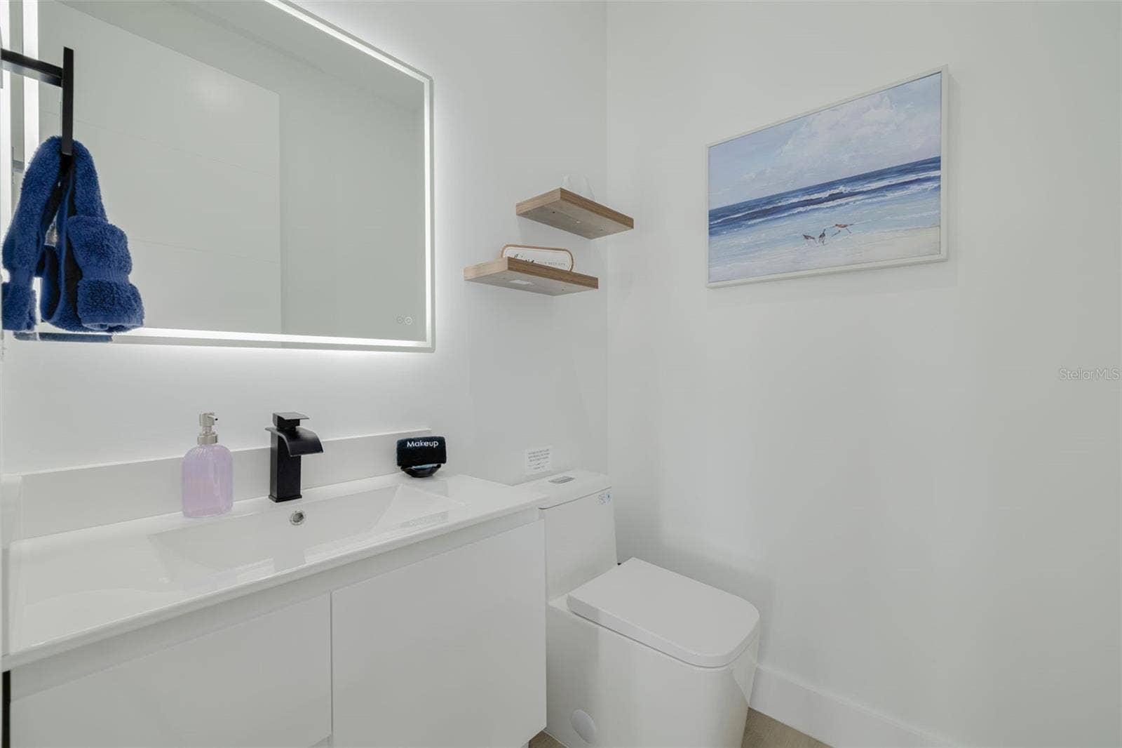 7609 DEEDRA CIRCLE, Port Richey, FL 34668 Half bathroom on the main floor just off the kitchen.