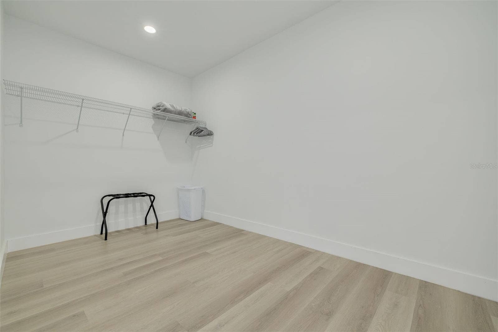 7609 DEEDRA CIRCLE, Port Richey, FL 34668 Large walk in closet with a section for a large built-in safe on the right side.