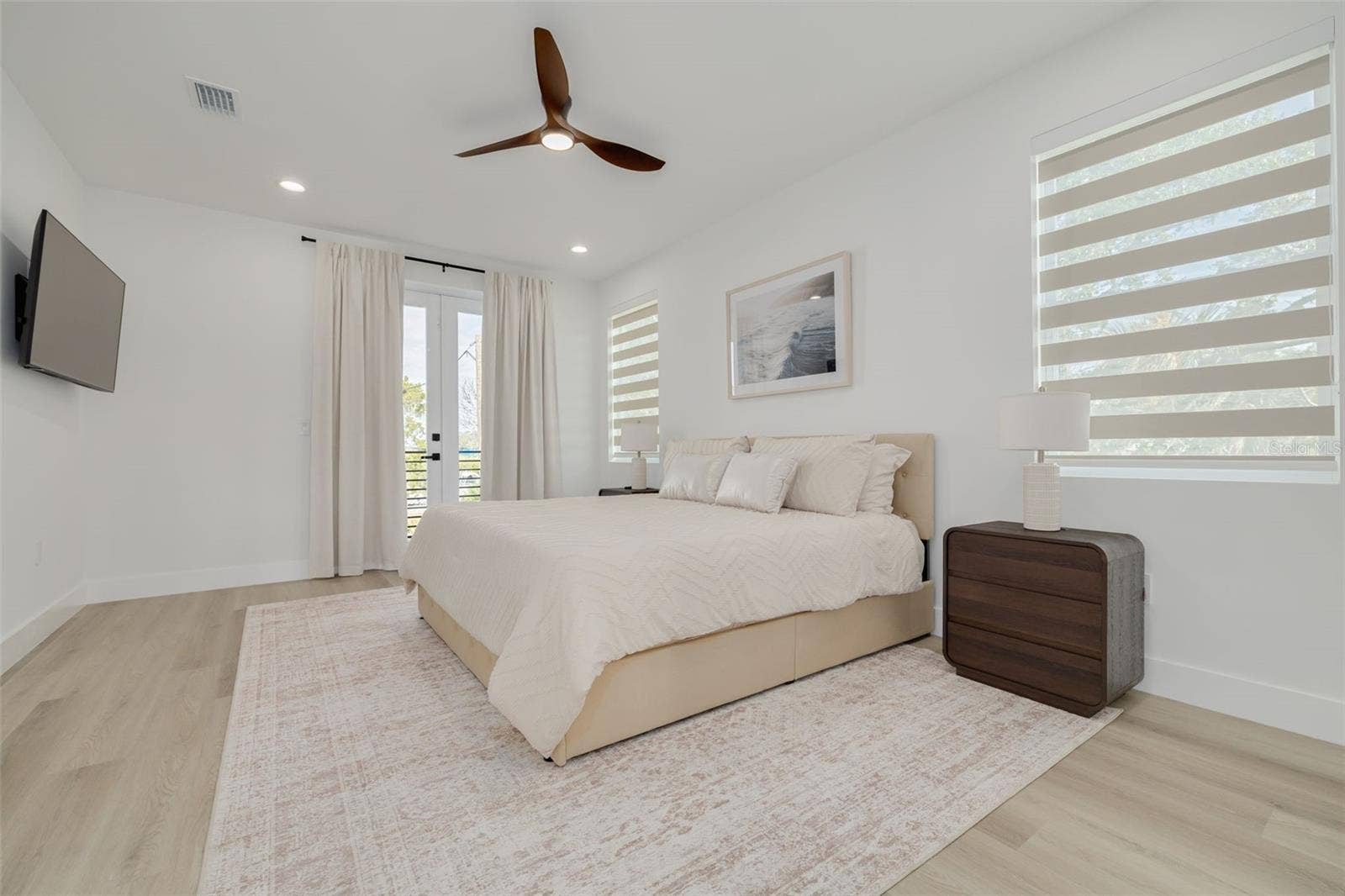 7609 DEEDRA CIRCLE, Port Richey, FL 34668 Bedroom with ensuite on the main living level.
