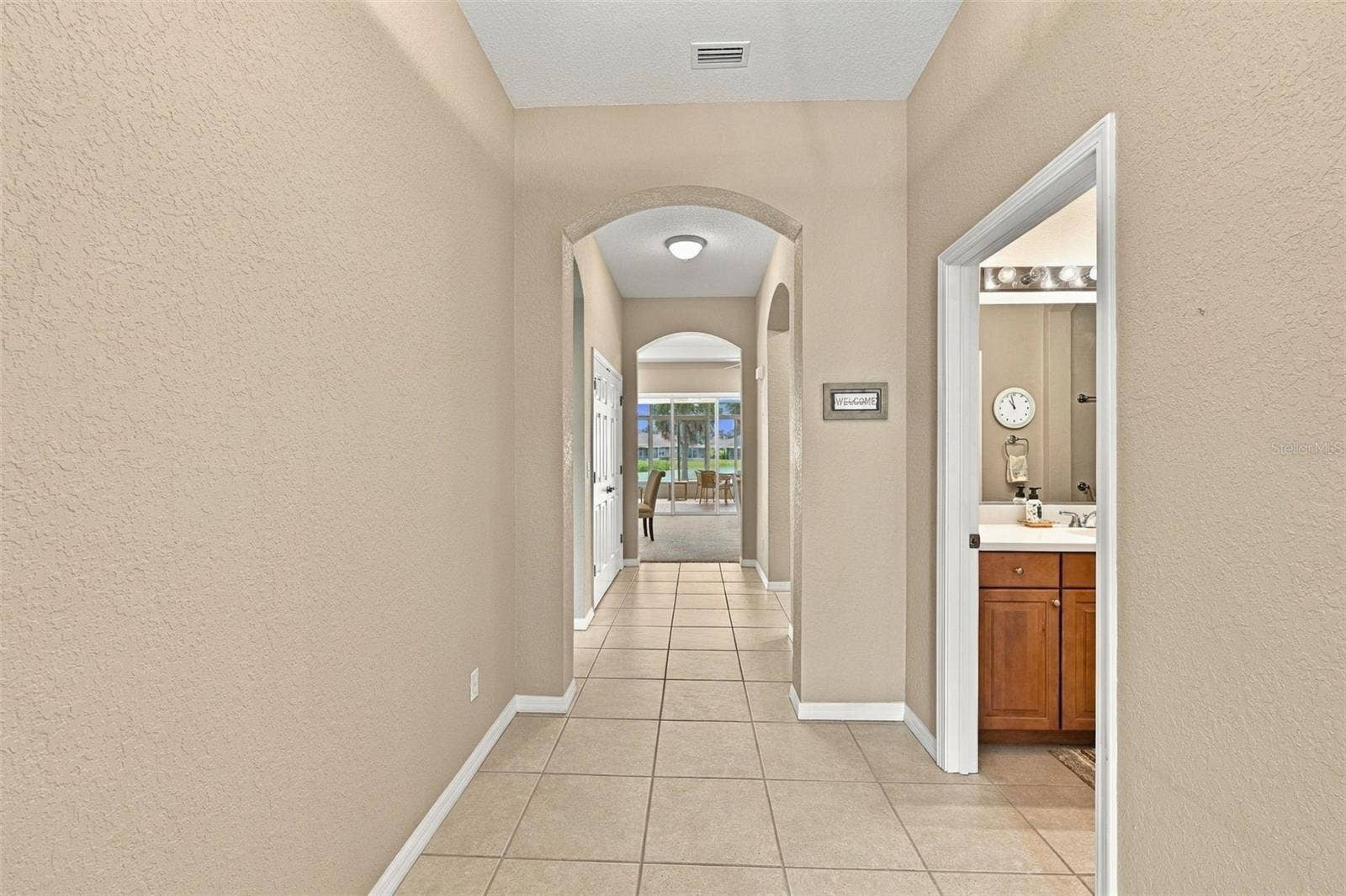2418 KENSINGTON GREENS DRIVE, #9, Sun City Center, FL 33573 Hallway from the Front Door