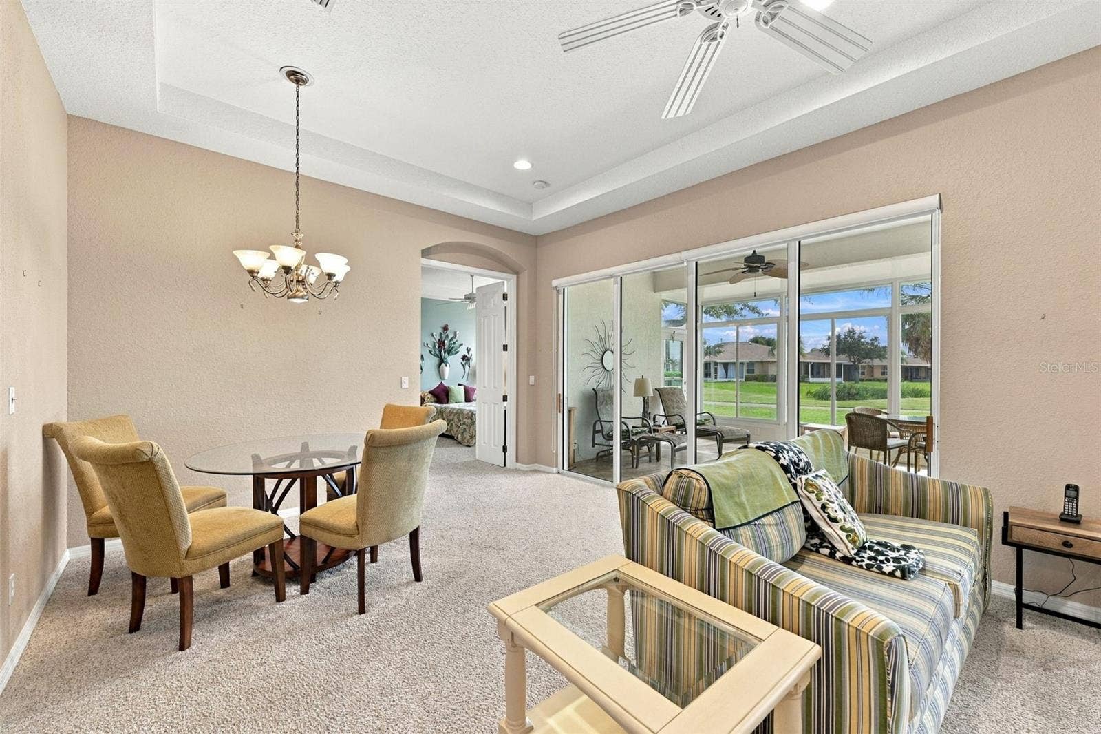 2418 KENSINGTON GREENS DRIVE, #9, Sun City Center, FL 33573 Family Room Looking into the Dining Area